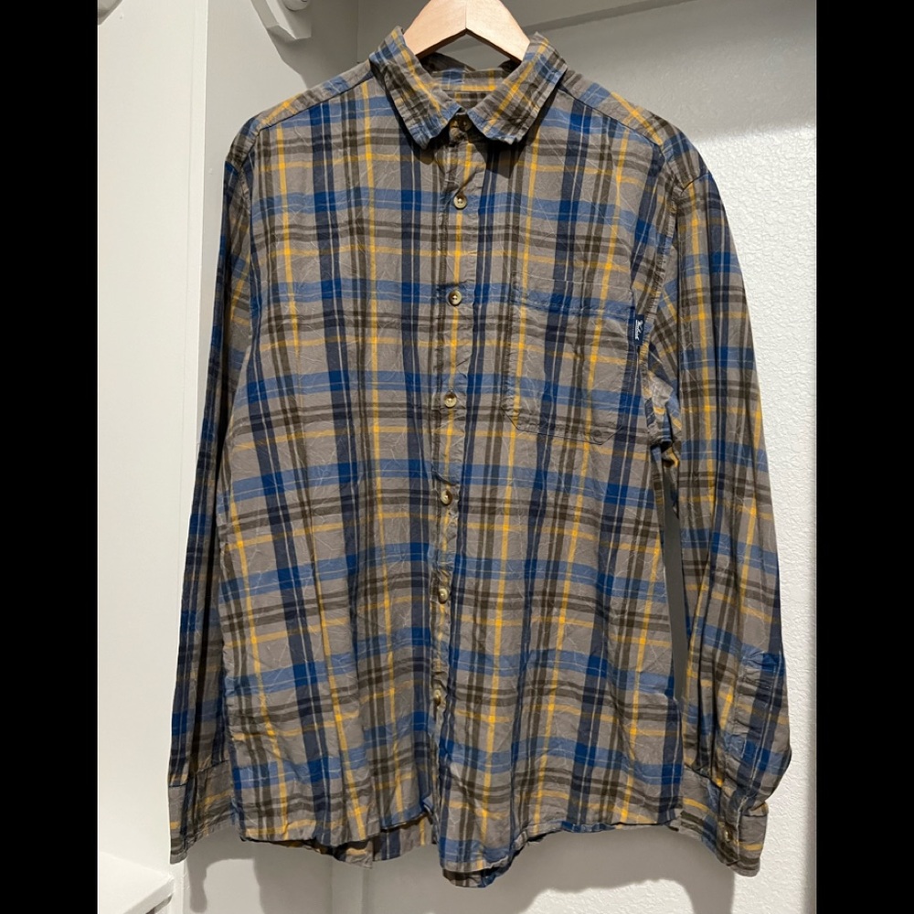 Size Large Woolrich Red Creek distressed long sleeve plaid shirt.